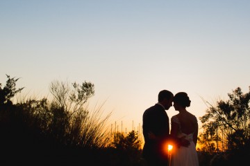 beautiful wedding portraits taken at sunset by charleston wedding photographers king street studios